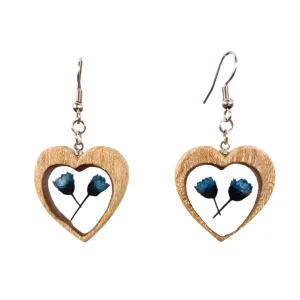 Heart-shaped elm wood pendant earrings with blue flowers preserved in resin, silver-plated hardware.
