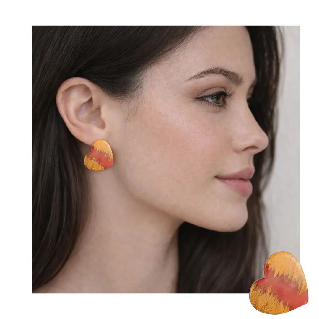 Model wearing heart earrings in wood and coral resin - right side view