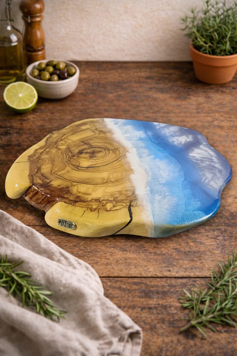 Olive board with blue beach-effect resin in a rustic kitchen setting.